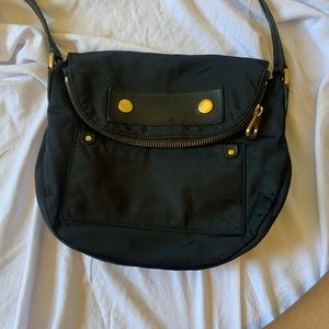 Marc Jacobs Crossbody.Adjustable Strap Hidden Zipper pocket for extra storage.
